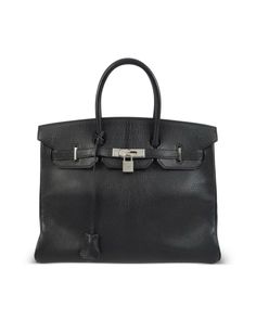 Constructed with a spacious trapeze-shaped body and delicate metal feet for added structure, this Birkin 35 version is crafted from Togo leather in a black colourway. Togo Leather, Versace Outfit, Chanel 2, Iconic Bags, Loafer Mules, Handbag Black, Boots And Sneakers, Flat Boots, Ballet Flat Shoes