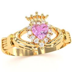 Claddagh lab-created pink sapphire and diamond ring crafted in solid 14k yellow gold. For centuries, Claddagh jewelry has been given as a token of true love and friendship. Two hands holding the heart surrounded by 12 sparkling earth-mined diamonds is a sign of everlasting affection. Sapphire is the official birthstone for September and represents honesty, loyalty, purity, and trust. Diamonds are thought to provide the wearer with better relationships and increase inner strength. Lab-Created Pin Pink Sapphire Yellow Gold Promise Jewelry, Yellow Gold Pink Sapphire Promise Jewelry, Yellow Gold Pink Sapphire Jewelry For Promise, Gold Pink Sapphire Ring With Brilliant Cut, Gold Brilliant Cut Pink Sapphire Jewelry, Gold Jewelry With Pink Sapphire In Halo Setting, Heirloom Style Pink Sapphire Ring Gift, Heirloom Pink Sapphire Ring Gift, Heirloom Style Pink Birthstone Rings