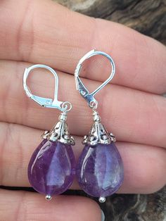 These natural purple amethyst teardrop shape are perfect for especial occasion or everyday wear. Length ( with lever back ) is around 1 1/2 inches.  The earrings with sterling silver lever back. The earring artive in gift box with beautiful rubbon for easy gift giving. Thank you for looking! Purple Gemstone Teardrop Earrings, Purple Amethyst Teardrop Earrings, Purple Amethyst Drop Teardrop Earrings, Nickel Free Purple Teardrop Crystal Earrings, Nickel-free Purple Teardrop Crystal Earrings, Purple Dangle Teardrop Earrings With Ear Wire, Purple Gemstone Teardrop Dangle Earrings, Lavender Teardrop Earrings With Ear Wire, Handmade Amethyst Teardrop Crystal Earrings