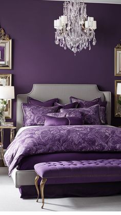 a bedroom with purple walls and a chandelier