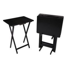 two small black tables sitting next to each other