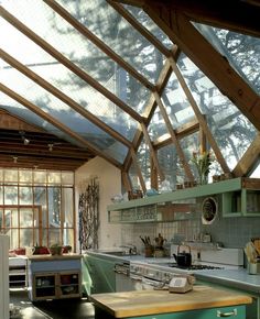 a kitchen with green cabinets and an open roof