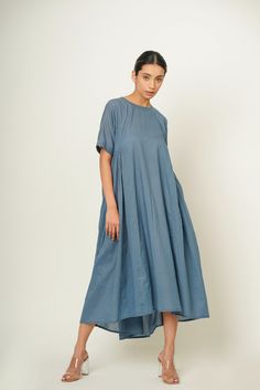 "Introducing our Summer Piece of Sky Blue, Side-Back Gather Dress, meticulously crafted from organic cotton for a luxurious feel with eco-conscious flair. This size inclusive vacation essential boasts a refreshing hue and comfortable modest fit, complemented by thoughtful side and back gathers with convenient pockets and button closure at back. Whether wandering the beach or exploring new destinations, it ensures effortless style and comfort for your summer escapades. Specifications: Length: Front: 44.5\" Back: 50.5'' , Customize it to your preference! Quality: Organic cotton Shipping Details: Ships within 3-5 working days. Need it sooner? Drop us a message for expedited delivery options. Additional Features: Colour: Customize it to your preference! (Pictured: Piece of sky blue) Feel: Soft Blue Cotton Relaxed Fit Maxi Dress, Relaxed Fit Cotton Maxi Dress For Daywear, Casual Organic Cotton Summer Dress, Blue Cotton Relaxed Fit Dress, Cotton Maxi Dress With Relaxed Fit, Summer Indigo Cotton Maxi Dress, Spring Cotton Maxi Dress With Natural Dye, Summer Cotton Maxi Dress With Natural Dye, Spring Cotton Maxi Dress With Relaxed Fit