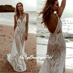 a woman standing on top of a beach next to the ocean wearing a white dress