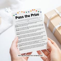 a person holding up a piece of paper with the words pass the prize on it