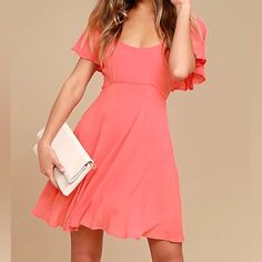 This Coral Pink Skater Dress Is Always Ready For Any Special Occasion That Comes Its Way! Lightweight Woven Fabric Forms Fluttering, Elasticized Sleeves Atop A Darted Bodice, Fitted Waist, And Flaring Skater Skirt. Tying Back, Plus Hidden Back Zipper. Lined. 100% Viscose. Hand Wash Cold Pink Mini Dress With Flutter Sleeves For Spring, Pink Flutter Sleeve Mini Dress For Party, Pink Flutter Sleeve Mini Dress For Summer, Pink Fitted Midi Dress With Flutter Sleeves, Pink Flutter Sleeve Mini Dress For Day Out, Summer Pink Mini Dress With Flutter Sleeves, Feminine Flutter Sleeve Dress, Pink A-line Midi Dress With Ruffle Hem, Pink Flutter Sleeve Midi Dress For Party