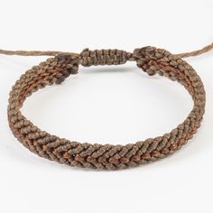 "Brown friendship bracelet perfect Father's Day gift. Ankle bracelet excellent birthday gift for teens. Two colored mocha brown and dark brown macrame bracelet made from waxed thread. The center of the bracelet has a different knotting style and different color. Each thread knotted together to make this extremely interesting pattern. These bracelets are gender-neutral. The width of the bracelet is 8 millimeters.  The bracelet closes with an adjustable design. There are four options: 14.5cm for regular/average wrist size and 17cm for larger wrists.  20cm for regular/average ankle size and 22cm for larger ankles.  Please feel free to message me with any special orders: *Different colors  *Sizes *More than one All of our bracelet designs are extremely durable. They are waterproof because of t Adjustable Brown Bracelet As Gift, Adjustable Brown Bracelet Perfect As A Gift, Brown Bracelets As A Gift, Bohemian Brown Braided Bracelets For Gifts, Bohemian Brown Braided Bracelets As Gift, Bohemian Style Brown Braided Bracelets As Gift, Bohemian Brown Braided Bracelet Gift, Handmade Brown Bracelets For Friendship, Gift Brown Braided Bracelets With Sliding Knot