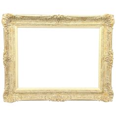 an ornate white frame with gold trimmings on the edges and bottom, against a white background