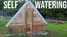 a small wooden house with the words self watering above it