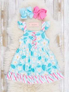 This Teal Daisies & Candy Stripes Ruffle Dress will have your little fashionista blooming with joy! Featuring a playful mix of florals and candy stripes, this sister set puts the fun in functional. With its ruffle detailing and trendy teal color, your little one will be the talk of the playground. Fits true to size. 95% Polyester / 5% Spandex Accessories sold separately. Suggest bow color #55 and #64 Import. Lydia is 49 inches tall and 61 lbs wearing size 3XL (7 YRS). **Afterpay and Sezzle Purch Playful Spring Twirl Dress For Playdate, Sweet Spring Vacation Dress, Sweet Spring Vacation Dresses, Summer Playtime Twirl Dress With Ruffle Hem, Playful Ruffled Twirl Dress For Summer, Playful Cotton Twirl Dress For Spring, Summer Twirl Dress With Ruffle Hem For Playtime, Cute Spring Twirl Dress For Playwear, Playful Summer Twirl Dress With Floral Print