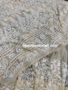 "Soft beige Chikankari georgette saree with hand embroidery and delicate gold \"Mukaish\" add ons and crochet lace. Heavy palla and broad border all along the body. Flowy sheer fabric! Includes an embroidered blouse piece too. Fall attached and petticoat included" Cream Anarkali Set With Intricate Embroidery In Georgette, Cream Anarkali Set With Intricate Embroidery, Festive Off White Georgette Blouse Piece, Cream Lace Work Dupatta For Eid, Festive Beige Saree With Intricate Embroidery, Cream Georgette Sharara With Zari Work, Cream Blouse Piece With Cutdana For Eid, Elegant Embroidered Georgette Fabric With Lace Work, Cream Dupatta With Lace Work For Festive Occasions