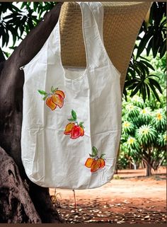 Best selling gift from Kaua'i Hawaii.  The farmers market tote shopping bags are super light weight cotton they fold up and fit in to the inside pocket which can also hold your money or credit card, I gave these out as gifts this year and they were such a huge hit I am adding these to my shop.  I am increasing the number of stamps on each bag as I repaint them.   Fabulous Kaua'i gift that won't break the bank.  Perfect bridesmaid gift - or holder for bridesmaids gifts for your Hawaii wedding.    These bags are also sold here on Kaua'i @ Kauai Pottery and Handmade Art at the Coconut Marketplace in Kapaa.    Makes a wonderful gift from Kaua'i Hawaii for that special someone and is a wonderful way to carry a little bit of Aloha around with you.   These bags are also great to use as a package Summer Cotton Shoulder Bag For Daily Use, Summer Cotton Bags For Daily Use, Summer Cotton Beach Bag For Daily Use, Summer Cotton Beach Bag For Everyday Use, Eco-friendly Cotton Bag For Vacation, White Casual Cotton Beach Bag, Casual White Cotton Beach Bag, White Cotton Vacation Bag, White Cotton Vacation Bags