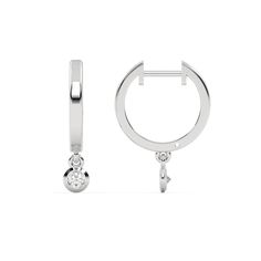 Small gold hoop earrings featuring a dangling 0.10 CT diamond on each hoop, securely set in a bezel setting.Details: - Made to Order- Diamond Weight: 0.20 CT - No of Diamonds: 2- Diamond Type: Lab Grown Diamond (CVD, HPHT)- Diamond Cut: Round- Diamond Clarity: VS - Diamond Color: Colorless (DEF)- Setting Type: Bezel- Metal Type: 14K Solid Gold,18K Solid Gold- Choice of Gold Color: Yellow Gold, White Gold, Rose Gold- Jewelry Certification: Jewelry priced above $500 includes Third Party Lab Certif White Gold Hoop Earrings With Single Diamond, Fine Jewelry Huggie Earrings With Bezel Setting, White Gold Dangle Hoop Earrings For Anniversary, White Gold Huggie Earrings With Bezel Setting, Elegant Small Hoop Earrings With Bezel Setting, Anniversary Hoop Earrings With Bezel Setting, White Gold Dangle Hoop Earrings With Lever Back, White Gold Lever Back Dangle Hoop Earrings, Fine Jewelry Hoop Earrings With Bezel Setting For Anniversary