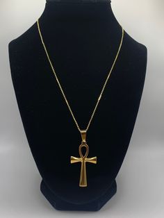 Ankh Necklace, Gold Ankh Necklace, Silver Ankh Necklace, Egyptian Necklace, Gold Necklace, Silver Necklace Elevate your style and spirituality with our Ankh Necklace. This timeless accessory is the perfect addition to any outfit.  Add a touch of sophistication with this beautiful, classic accessory that evokes positive energy and serves as a powerful symbol of life and eternity. Make a statement with this beautiful piece! Chain:     18K Gold Plated                  17.5 inch chain with 2 inch extender                  Lobster Claw Clasp Gold Pendant: 44.5mm long, 25.5mm wide Silver Pendant: 44.5mm long, 27mm wide Luxury Spiritual Long Necklace, Affordable Black Spiritual Necklaces, Shifting Realities Symbol Necklace, Cheap Black Spiritual Necklaces, Cheap Silver Ankh Necklace, Cheap Ankh Shaped Spiritual Jewelry, Gold Spiritual Necklace, Cheap Ankh Spiritual Jewelry, Cheap Ankh Shaped Metal Jewelry