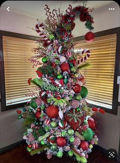 a christmas tree decorated with candy canes and ornaments