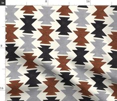 an image of a fabric pattern with brown and black triangles on white background, as well as measurements