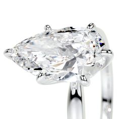 a ring with a pear shaped diamond on it