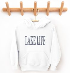 Kids Lake Life Hoodie Sweatshirt, Youth Lake House Vacation, Great Lakes Pullover Design has been distressed for a vintage look. The sweatshirts in the pictures are solid color with soft fleece inner lining. They are not pigment-dyed or vintage. * 50% Cotton / 50% Polyester * Medium-heavy fabric (7.75 oz /yd² (262 g/m * Regular Fit * Double-lined hood * Double-needle stitching throughout * Air-jet spun yarn with a soft feel and reduced pilling * Kangaroo front pouch pocket * Sewn in label * Runs true to size PROPER SIZING Please see photos to see a specific sizing chart for this shirt style. These shirts are unisex size, meaning they are not women's fitted shirts. If would like a more fitted look, we suggest that you size down. To get your size, lay your favorite shirt at home flat, measur White Distressed Sweatshirt, White Distressed Long Sleeve Sweatshirt, White Distressed Casual Sweatshirt, White Distressed Sweatshirt For Fall, Lake House Vacation, Lake Havasu, Pullover Designs, Lake Life, Fabric Softener