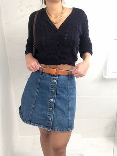 Cute fitted high waisted denim skirt with button up design fastening. Best fits a size 6 or XS. Denim Blue High Waist Skirt With Button Closure, High Waist Denim Blue Skirt With Button Closure, Chic Button-up Denim Skirt, Chic Button-up Denim Skirt With Buttons, High Waist Dark Wash Buttoned Denim Skirt, High Waist Button Closure Denim Skirt For Day Out, High Waist Dark Wash Denim Skirt With Buttons, Denim Skirt With Button Closure For Day Out, High Waist Dark Wash Skirt With Buttons