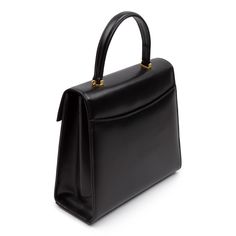 Juliet Handbag in Black/Black A much larger version Launer’s most famous Traviata design. The leather used to make these soft leather handbags is imported from Italy and only butter-soft, unblemished hides are selected. Every piece has perfectly rounded corners and smooth, turned-edging—a hallmark of the highest quality leatherwork. Just as elegant as the exterior, the interior is fully lined in Italian suede. Craftsmanship is paramount. Every piece of leather is hand-cut, every seam handsewn, a Launer London, Soft Leather Handbags, Handbag Heaven, Black Handbags, Black Interior, Leather Working, Rounded Corners, Fashion Handbags, Soft Leather