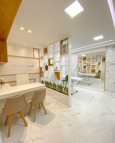 an office with marble floors and white walls