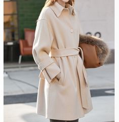 Product Description: handmade Cashmere coat high grade fabric,cashmere fabric.also could be custom made with any size and other colors,please feel free to contact with me if you want custom it. Material: cashmere 100% Size: S: Bust : 102 cm shoulder and Sleeve:70cm Length:105cm M: Bust : 106 cm shoulder and Sleeve:71cm Length:105cm L: Bust : 112cm shoulder and Sleeve:72cm Length:105cm XL: Bust : 116cm shoulder and Sleeve:73cm Length:105cm Shipping we ship worldwide the USPS takes about 15 days a Winter Cream Single Breasted Wool Coat, Luxury Wool Sweater Coat For Fall, Winter Cashmere Outerwear With Pockets, Cream Wool Coat For Business In Winter, Winter Business Cream Wool Coat, Classic Wool Coat With Stand Collar For Winter, Long Cashmere Sweater Coat For Fall, Cashmere Long Sweater Coat For Fall, Fall Cashmere Long Sweater Coat