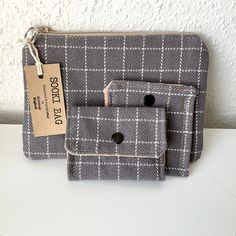 "Handmade purse, card wallet & a small pouch.  All three made using a mid grey & white checked upholstery fabric.   Zipper on the clutch and snap fasteners on the wallet & pouch.  Would make a perfect little gift! Zipper pouch: 19cm (7-1/2\") wide x 13cm (5-1/4\") high Card wallet:  10cm (4\") wide x 8cm (3\") high Small pouch:  9cm (3-1/2\") wide x 10cm (4\") high  Total weight 90g (3-1/4oz)" Gray Bags With Card Slots For Everyday Use, Gray Rectangular Wallet For Everyday Use, Everyday Gray Bag With Card Slots, Gray Bags With Card Slots For Daily Use, Gray Wallets With Interior Card Slots, Gray Wallets With Card Slots For Everyday Use, High Card, Ear Bud, Handmade Purse