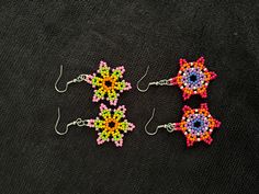 handmade earrings using 2 millimeter seed beads. Handmade Colorful Beaded Round Earrings, Handmade Multicolor Flower Earrings With Round Beads, Multicolor Bead Cap Drop Earrings, Multicolor Round Beads Flower Earrings As Gift, Multicolor Round Beads Flower Earrings For Gift, Multicolor Drop Earrings With Bead Caps, Multicolor Beaded Dangle Earrings With Bead Caps, Handmade Multicolor Beaded Earrings In Flower Shape, Multicolor Beaded Dangle Earrings