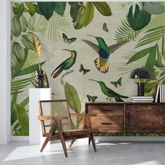 the wallpaper in this room is decorated with tropical leaves and hummingbirds, which are flying