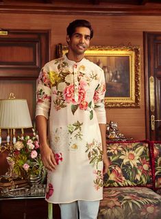 Editor's Note Featuring a long kurta with floral print in chanderi base, styled with a contrast churidar. Fabric: Chanderi Color: Pink, cream Components: Kurta and pant Occasion: Festive Disclaimer: Product color may slightly vary due to photographic lighting sources or your monitor setting. Care: Dry Clean Only About the Designer Kalista is a luxury fashion label that specializes in designer clothing for millennial women. Founded by fashion designer turned entrepreneur, Pratyush Guglani, this i Pink Kurta, Long Kurta, Kurta Set For Men, Churidar, Kurta Set, Full Sleeves, Fashion Labels, Floral Printed, Aza Fashion