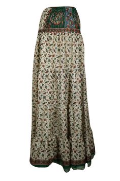 Embrace your free-spirited side with our Boho Chic Maxi Skirt, designed for the modern soul who loves to blend Beige, Green Leaf Printed Stylish comfort and style. This flowing, maxi-length skirt features vintage-inspired tribal prints and earthy tones, perfect for creating a laid-back yet hippie-style look. Handcrafted with care, the skirt boasts tiered layers and subtle, giving it a graceful, gypsy flair. Whether you're strolling on the beach or attending a festival, this relaxed-fit statement Flowy Boho Print Tiered Maxi Skirt, Flowy Maxi Skirt With Boho Print, Bohemian Long Maxi Skirt With Floral Print, Flowy Floral Print Maxi Skirt For Festival, Floral Print Flowy Maxi Skirt For Festival, Flowy Floral Maxi Skirt For Festival, Hippie Floral Print Maxi Skirt For Vacation, Hippie Boho Print Flowy Maxi Skirt, Hippie Style Flowy Maxi Skirt With Boho Print