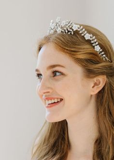 Consider your wow-factor secured: The Vivienne Tiara beautifully combines vines of hand-set Swarovski crystals, with delicate hand-carved mother of pearl flowers. The sparkle of the crystals is amplified by the shimmering mother of pearl, creating a truly unforgettable moment. This tiara is finished in the back with a ribbon tie for a secure fit. Dimensions: 2in crown Weight: 43g Headband Collection, Face Proportions, Luxury Hair Accessories, Tiaras Jewellery, Pearl Flowers, Fashion Shoots, Pearl Tiara, Jennifer Behr, Fascinator Headband