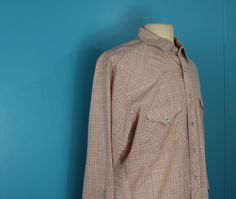 "Vintage 1980's/90's western shirt by Enro. Pattern is plaid. Colors are pink, purple, yellow and blue. Made of polyester, cotton and acrylic. Long sleeve. Button down with pearl snap buttons. Pockets on both sides of chest. There is fraying on the seam on the left side by the neck. Please look at the last picture. *Please note that vintage clothing comes with wear and tear. I do my best to try and make any flaws with a garment known to customers. I want you to know what you are buying before it Argyle Vest, 90s Shirts, Bow Blouse, Western Shirt, Yellow And Blue, Beautiful Blouses, Western Shirts, Western Wear, I Want You