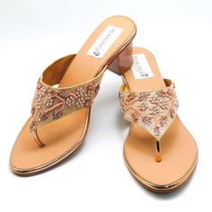 Rose Gold beaded embroidered design strap sandals offer a comfortable sole to walk on. They are beaded with Silver, light gold Rhinestones and Rosegold beads. These shoes are absolutely comfortable and offer a simple yet elegant design. These are perfect for a night out or a simple day. See our page for more of our collection of shoes we offer. We ship out in a timely matter, wrapped in care for a safe secure trip to your location. Thank you for supporting our small business. Shipped from the USA. Sizes available US 6,7,8,9,10,11. Gold Embellished High Heel Sandals, Elegant Embellished Block Heels For Summer, Gold Embellished Flat Sandals, Gold Embellished Open Toe Heels, Summer Embellished Gold Heels, Summer Gold Embellished Heels, Gold Embellished Sandals With Single Toe Strap, Gold Block Heel Sandals For Wedding, Gold Heels With Single Toe Strap For Wedding