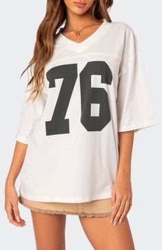 Your favorite year, your team number or your lucky number—keep 'em all guessing when you slip into the oversized jersey-inspired T-shirt made from soft cotton. V-neck Elbow-length sleeves 100% cotton Machine wash, dry flat Imported Oversized Jersey, Flannel Sweatshirt, Retro Jersey, T Shirt Oversized, Low Rise Jeans, Sweaters And Jeans, Oversized T Shirt, Top Fabric, Jersey Top