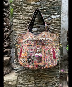 About bag  Indo-gypsy fusion, everyday use hand bag made from Banjara fabrics sourced from Vintage tribal costumes of regions of Rajastan and Gujarat. These are embellished with light catching coins, and intricate bead work tassels. Size - length 15 inches/ width 21 inches Company details:  Company name: Houseoftextile  Contact number: +919784447473  Email id: houseoftextile77@gmail.com  Shipping & custom : Delivery through one of the finest service providers : Skyway, Fedex, UPS  And DHL. Any l Festival Embroidered Multicolor Hobo Bag, Festival Multicolor Embroidered Tote Shoulder Bag, Embroidered Hobo Tote Bag For Festival, Traditional Multicolor Embroidered Hobo Bag, Multicolor Bags With Traditional Patterns For Everyday Use, Festival Multicolor Embroidered Hobo Tote Bag, Multicolor Embroidery Hobo Tote Bag For Festivals, Festival Multicolor Embroidery Hobo Tote Bag, Multicolor Tote Shoulder Bag For Festivals