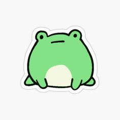 a green frog sticker sitting on top of a white surface with the words, i love