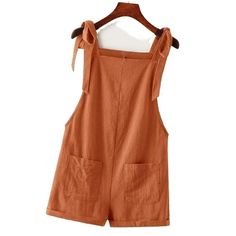 Adorable Tie Knot Strap Overall Shorts Pocket Jumpsuit In Rust Brown Fabric: 100% Cotton Design: Tie Knot Strap/ Double Pocket Front/ Roll Up Hem Small: Size 4 Length:31.1 Inch, Bust:35 Inch, Waist Size:35.8 Inch, Hip Size:4 0.9 Inch, Thigh:27.2 Inch, Straps Length:25.6 Inch Medium: Size 6 Length:31.6 Inch, Bust:36.6 Inch, Waist Size:37.4 Inch, Hip Siz E:42.5 Inch, Thigh:28 Inch, Straps Length:25.8 Inch Large: Size 8/10 Length:32.3 Inch, Bust:39 Inch, Waist Size:39.8 Inch, Hip Size:4 4.9 Inch, T Summer Beach Jumpsuits And Rompers With Pockets, Summer Cotton Overalls In Solid Color, Casual Cotton Overalls With Tie Straps, Solid Color Summer Jumpsuits And Rompers With Pockets, Cotton Overalls With Tie Straps, Cotton Jumpsuits And Rompers With Tie Straps For Summer, Summer Vacation Jumpsuits And Rompers With Tie Straps, Summer Overalls With Pockets For Vacation, Casual Beach Shortalls Overall