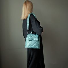 "Green mint bucket bag quilted with detachable strap. Handmade green nylon bucket shoulder bag for women. Height - 23 cm  ( 9,05 \" ) Width - 31 cm   ( 12,20 \" ) Depth - 9 cm ( 3,54 \" ) Strap  - 75 cm  ( 29,53 \" ) Green mint bucket bag made of quilted nylon fabric. Green shoulder bag has cotton lining, 1 pocket inside, detachable strap. The mint green bag fastens with 1 magnetic button. Green mini bag quilted for women. Mint mini shoulder bag quilted drawstring. Beautiful small handbag light green color. Designer green small handbag. Puffer green mint mini bag handmade. Quilted mini shoulder bag cute for woman. Mint green quilted bucket bag. Unique handmade green bucket drawstring bag. Cute mini bag green mint color." Mint Green Bag, Mint Green Bags, Cute Mini Bags, Green Shoulder Bag, Green Handbag, Green Quilt, Green Mint, Red Handbag, Small Handbag