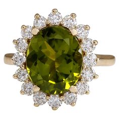 5.53 Carat Natural Peridot 14 Karat Yellow Gold Diamond Ring Stamped: 14K Yellow Gold Total Ring Weight: 5.0 Grams Total Natural Peridot Weight is 4.47 Carat (Measures: 12.00x10.00 mm) Color: Green Total Natural Diamond Weight is 1.06 Carat Color: F-G, Clarity: VS2-SI1 Face Measures: 17.75x15.65 mm Sku: [702638W] Yellow Gold Cocktail Ring, Yellow Gold Diamond Ring, Peridot Stone, Gold Cocktail, Rings Gold, La Face, Peridot Ring, Green Diamond, Green Peridot