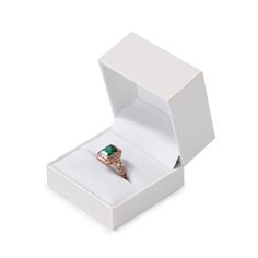 an open white box with a ring in it's center and two diamonds on the inside