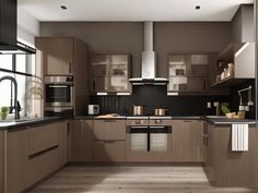 a modern kitchen with wooden cabinets and black counter tops