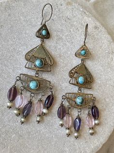 Beautiful Boho Middle Eastern Bedouin Gilt metal filigree Turquoise Amethyst Vintage Long Earrings See pictures next to ruler for scale They are tribal so earwires apear slightly thicker then modern pirced posts Bohemian Teardrop Filigree Jewelry, Ornate Handmade Turquoise Jewelry, Bronze Filigree Jewelry, Bohemian Chandelier Earrings With Intricate Design, Bohemian Turquoise Earrings With Intricate Design, Bohemian Teardrop Filigree Chandelier Earrings, Bohemian Teardrop Chandelier Earrings With Filigree, Turquoise Bohemian Earrings With Intricate Design, Bohemian Amethyst Jewelry With Intricate Design