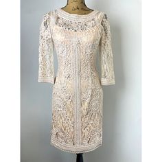 Sue Wong Cocktail Dress New With Tags Size 6, Sue Wong Sheer Dress Blush Neutral Brand New With Tags Beautiful Neutral/Blush Sue Wong Dress. Has Floral Sort Of Crochet Lace Design With Sheer Sleeves, Top Of Bodice, And Back. **Has Built In Bra So You Don't Have To Deal With Trying To Find An Uncomfortable One To Not Show Through The Sheer Back** True To Size But Is Supposed To Fit Tight. If You Are A Size 8 It Will Be Too Small Because It Hugs The Figure, Would Best Fit 4-6 Tag:6 Chest Across: L Elegant Beige Knee-length Lace Dress, Beige Midi Lace Dress For Formal Occasions, Fitted Knee-length Neutral Mini Dress, Elegant Long Sleeve Cream Lace Dress, Fitted Neutral Knee-length Mini Dress, Elegant Beige Mini Dress With Lace Trim, Elegant Beige Mid-length Dress, Cream Lace Midi Dress For Evening, Cream Knee-length Mini Dress For Wedding