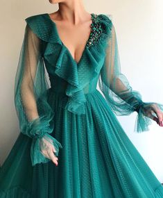 Green Spring Party Gown, Green Tulle Party Dress, Evening Tulle Dress With Long Sleeves, Evening Long Sleeve Tulle Dresses, Green Tulle Dress For Party, Fitted Green Long Sleeve Party Dress, Green Fitted Long Sleeve Party Dress, Long Sleeve Ruffled Gown For Gala, Fitted Green Long Sleeve Dress For Party