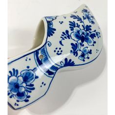 Vintage bright blue and white hand-painted Delft Dutch clog shoe numbered 707. Features traditional floral design. Would make a great catchall, planter or ashtray. Marked Delft on underside.  Natural age wear.  No cracks or chips to porcelain. Dutch Shoes, Traditional Floral Design, Dutch Clogs, Clog Shoe, White Hand, Clogs Shoes, Delft, Bright Blue, Clogs