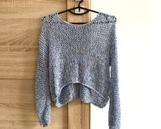 "Blue oversized top with gray mix color Loose cotton top  Color on the photo : CLOUDY Size on the photo: S ✔️55 % cotton  ✔️45 % acrylic  READY TO SHIP Dimensions for S size: Length - 44 cm. / 14.9\" Width - 50-55 cm. / 19.6\"-21.6\" Sleeve length - 62-65cm. /24.4\"-25.5\" Sleeve girth  - 28 cm. / 11\" Weight - 0.19 kg. /6.7oz MORE COLORS: www.etsy.com/listing/662063364 This sweater is light and transparent  Simple natural arm knit women sweater arm knit from the half cotton yarn. The sweater is soft. This is stylish design for your looks simple but great outfit for different events: home, job, meetings evenings, days. Great outfit top for summer period 🔻Please note that the colour may slightly vary due to photographic lighting sources or your monitor settings." Oversized Chunky Knit Cotton Tops, Oversized Chunky Knit Gray Top, Oversized Gray Chunky Knit Top, Blue Chunky Knit Casual Top, Blue Chunky Knit Trendy Tops, Blue Casual Chunky Knit Top, Trendy Blue Chunky Knit Top, Gray Chunky Knit Casual Top, Casual Gray Chunky Knit Top