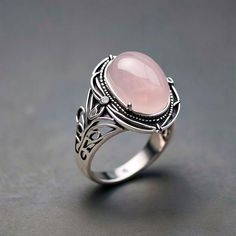 Minimalist Delicate Rose Quartz Sterling Silver Ring , Dainty Gemstone Boho Handmade Antique Ring For Women  Introducing our Minimalist Delicate Rose Quartz Sterling Silver Ring, a perfect blend of elegance and bohemian charm. This dainty gemstone ring features a beautifully polished rose quartz, renowned for its gentle, loving energy. Crafted by hand, the sterling silver band complements the soft pink hues of the gemstone, creating an exquisite piece that's both stylish and meaningful. Ideal for women who appreciate antique-inspired jewelry with a modern twist, this handmade ring is a timeless accessory that adds a touch of sophistication to any outfit. Whether you're looking to embrace your inner boho spirit or seeking a unique gift, this rose quartz ring is sure to be cherished. Note : Elegant Pink Rose Quartz Crystal Ring, Elegant Adjustable Rose-colored Ring, Elegant Rose Quartz Crystal Ring For Anniversary, Elegant Adjustable Pink Flower Ring, Bohemian Pink Wedding Rings, Silver Rose Quartz Crystal Ring Gift, Elegant Pink Crystal Open Ring, Oval Flower Ring For Promise, Bohemian Pink Rings For Anniversary