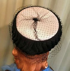 "This is a charming mid century, vintage, pillbox hat. No labels or tags, only a Union label. This pretty hat is made of pleated black fabric around the sides & smooth white fabric top. It is covered in a medium net veil. The hat measures 20\" around the inside, but really is a one size, pillbox hat, as it just perches on the head. The hat is in very good condition. No damage or soil. There are a few breaks in the netting. So sweet!" Adjustable Black Fascinator For Vintage Events, Vintage Brimmed Party Headpiece, Vintage Brimmed Headpiece For Party, Vintage Cloche Hat For Kentucky Derby Evening, Vintage Evening Cloche Hat For Kentucky Derby, Vintage Black Fascinator For Wedding, Retro Mini Hats With Curved Brim For Evening, Vintage Black Headpiece For Kentucky Derby, Vintage Cloche Costume Hat For Party