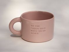 a pink coffee mug that says oh for puck's sake here we go again